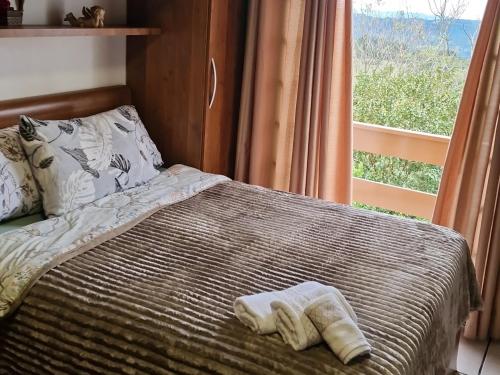 Postel nebo postele na pokoji v ubytování Suíte na Montanha