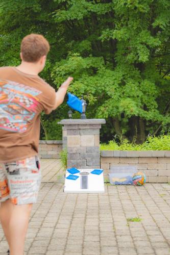 a young man playing a game with a water gun at Malkita Aria Mountainview Retreat in Woodbury