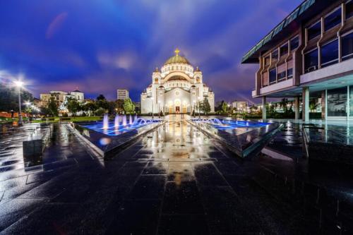 a large building with a fountain in front of it at RiverRetreat in Belgrade