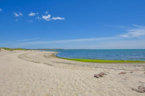 a sandy beach with the ocean in the background at Game Room Walk to Nantucket Sound in Chatham