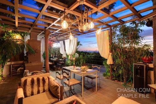 a patio with a table and chairs and a view at Marbella Boutique Art suites in Marbella