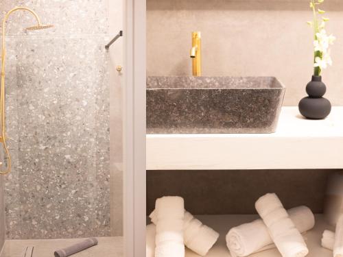a bathroom with a sink and a shower at Casa Bini in Pýrgos