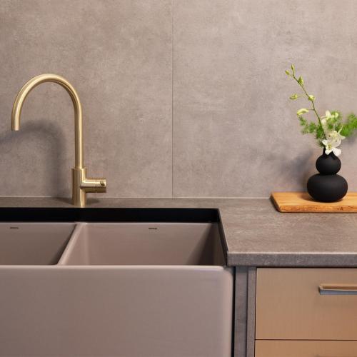 a kitchen with a sink and a vase with flowers at Casa Bini in Pýrgos