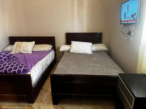 Postel nebo postele na pokoji v ubytování Sunset Guest house