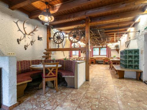 a restaurant with couches and tables in a room at Alpin Hideaway XL in Bruggberg