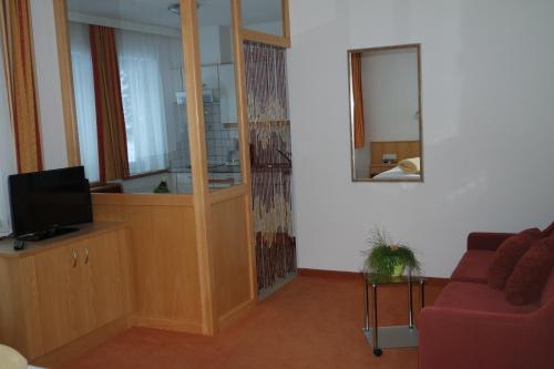 A television and/or entertainment centre at Apart Alina