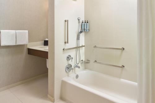a white bathroom with a tub and a sink at Residence Inn Washington, DC/ Downtown in Washington