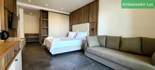 a living room with a couch and a bed at Ambassador & Ambassador Lux Apartments in Ulcinj
