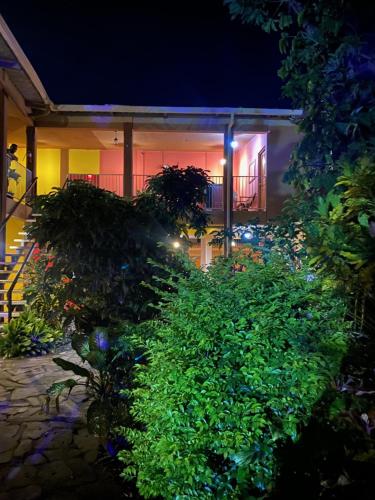 a garden in front of a house at night at Hotel Paraíso del Sur in San Juan del Sur