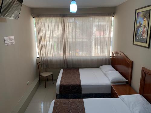 Postel nebo postele na pokoji v ubytování Hotel Belamar