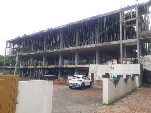 a building under construction with a car parked in front at Sri Kakateeya Grand Residency Bhadrachalam Hotel Residency Stay Rooms SRI SEETHA RAMA KAMMA VARI SEVA SAMITHI BHADRACHALAM in Bhadrāchalam