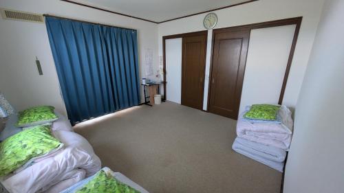 Katil atau katil-katil dalam bilik di Shino's Farm Inn