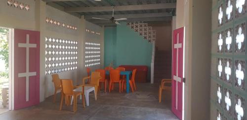 a dining room with a table and chairs at Villa Marina in Moñitos