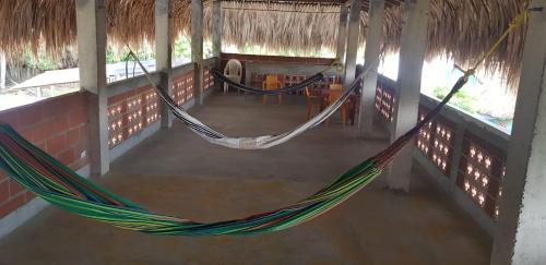 an overhead view of two hammocks in a room at Villa Marina in Moñitos