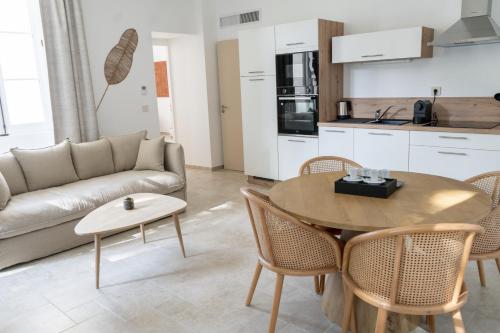 a living room with a couch and a table at Château de l'insolas in Villeneuve-lès-Avignon
