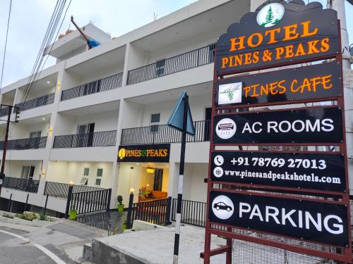 a hotel sign in front of a building at Hotel Pines And Peeks By Tws Hotels in Dalhousie
