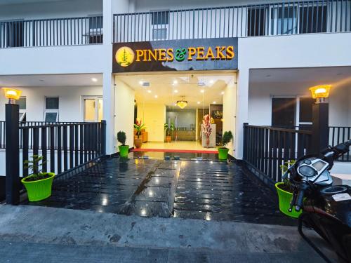 a entrance to a pines and peas restaurant at Hotel Pines And Peeks By Tws Hotels in Dalhousie