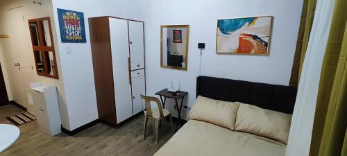 a living room with a couch and a table at Happy Homestay at Fullerton Suites Condo near Nuvali and Tagaytay in Silang