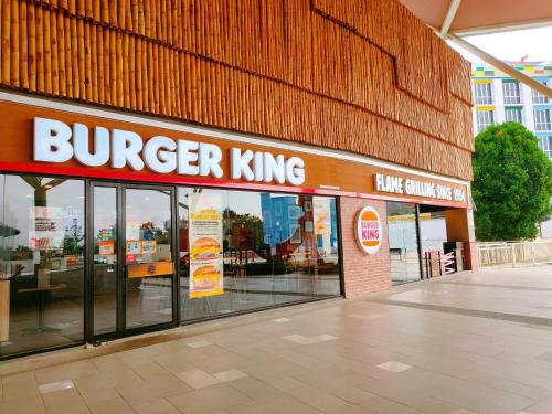 a burger king sign on the side of a building at Legoland-3mins Drive KUROMI FAMIY SUITE in Iskandar Puteri