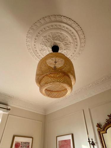 a chandelier hanging from a ceiling in a room at Clifton Apartment in Bristol