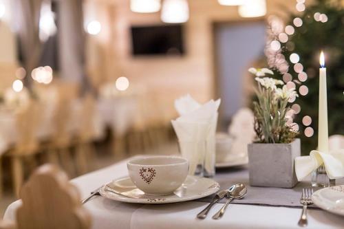 a table with a cup of coffee on top of it at Willa Litworówka III Wellness&SPA in Poronin