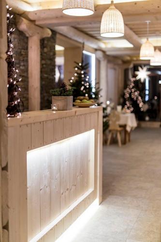 a wooden counter in a room with christmas trees at Willa Litworówka III Wellness&SPA in Poronin