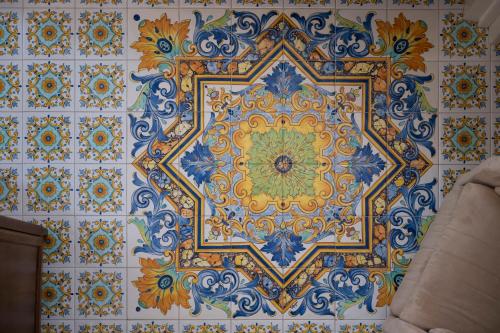 a tile wall with a colorful design on it at Residenza Luce in Amalfi
