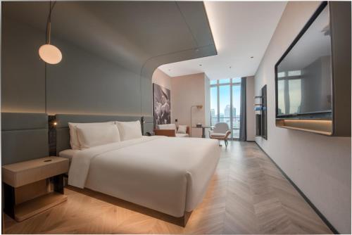 Ein Bett oder Betten in einem Zimmer der Unterkunft Atour S Hotel Shenzhen Nanshan Science and Technology Park Hi-Tech Centre