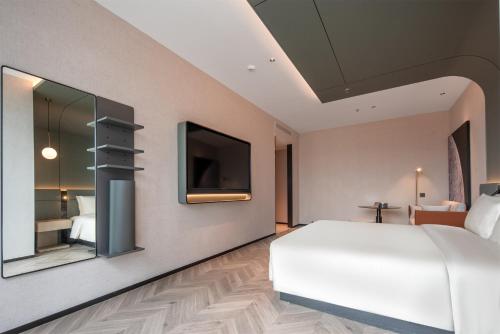 Ein Bett oder Betten in einem Zimmer der Unterkunft Atour S Hotel Shenzhen Nanshan Science and Technology Park Hi-Tech Centre