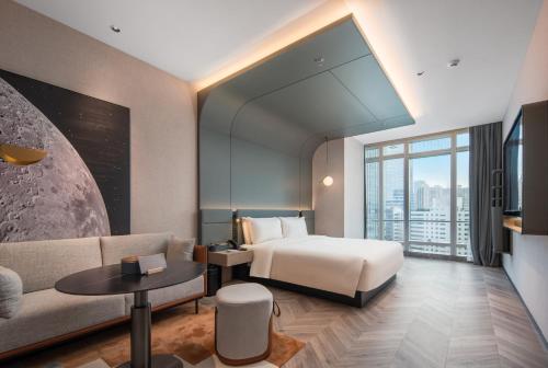 Postel nebo postele na pokoji v ubytování Atour S Hotel Shenzhen Nanshan Science and Technology Park Hi-Tech Centre