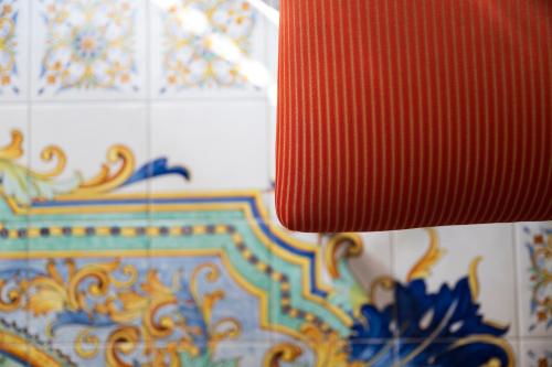 a close up of a red object on a wall at Residenza Luce in Amalfi