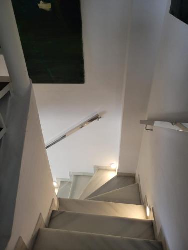 a staircase in a building with a green painting at Málaga casa grande familiar in Málaga