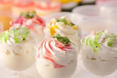 a row of plastic cups filled with different types of food at Hotel Angel Grandia Echigo Nakazato in Yuzawa