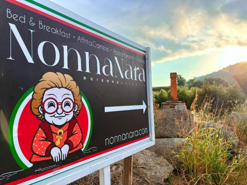 a sign for a restaurant with a clown on it at Nonna Nara Bed & Breakfast in Grosseto