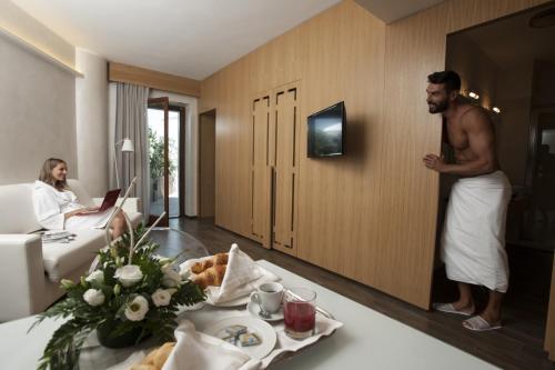 a man standing in a hotel room at Sport Village Hotel & Spa in Castel di Sangro