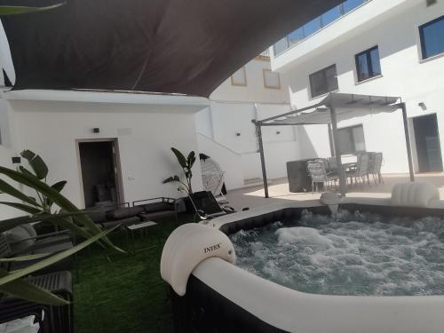 a hot tub in the backyard of a house at Hacienda Club Benalup in Benalup Casas Viejas