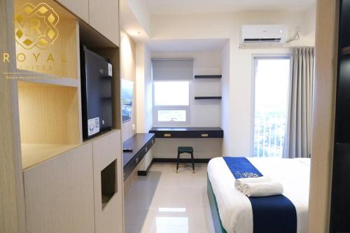 En eller flere senge i et værelse på Royal Suites Jumbo Studio 32SQ - Citra Plaza Nagoya