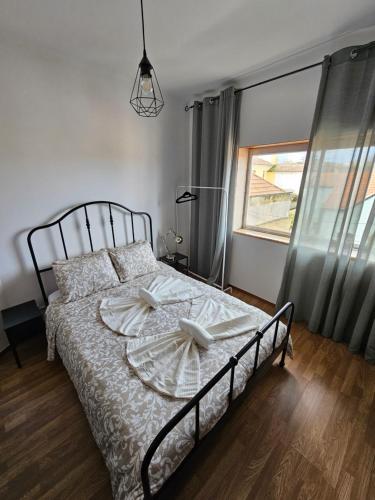a bedroom with a bed and a window at VILLAGE SINTRA gh in Sintra