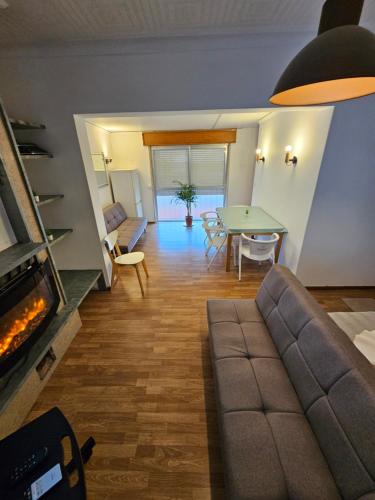 a living room with a couch and a table at VILLAGE SINTRA gh in Sintra