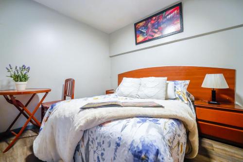 Кровать или кровати в номере Imperial Inn Hospedaje Turistico