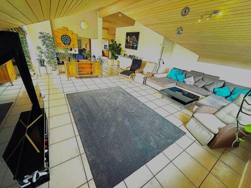 an overhead view of a living room with a couch at LakeVIEW Penthouse in the heart of Switzerland in Sempach