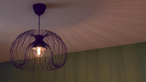 a chandelier hanging from a ceiling in a room at Bello Lake Como Brunate in Brunate