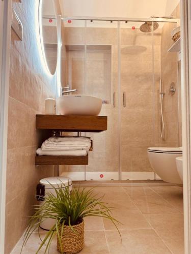 a bathroom with a sink and a shower at La dimora del faro in Bari