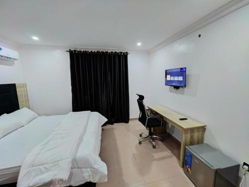 TV a/nebo společenská místnost v ubytování Lekki City View Apartment