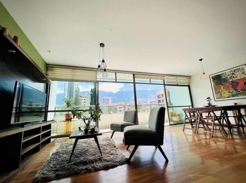 a living room with a view of a city at Departamento de 2 pisos en zona norte Cochabamba in Cochabamba