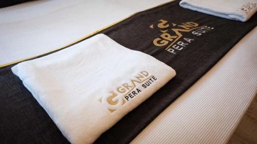 a book with a napkin on top of a table at New Armila Suites in Trabzon