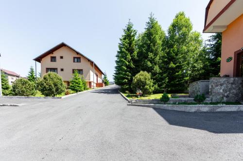 an empty road in front of a house at Resort EuroPark Fundata in Fundata
