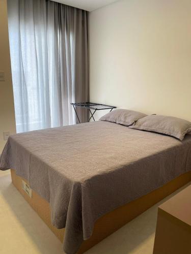 Postel nebo postele na pokoji v ubytování Ap 2 4 com suíte Edifício City House