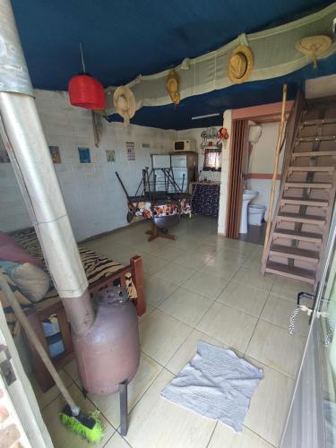 a view of a room with a kitchen with a stove at Altos de Piriapolis2 in Piriápolis