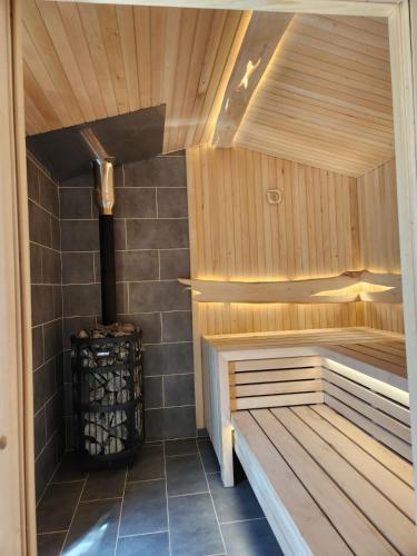 a sauna with a bench in a room at LOFT HOUSE in Skhidnitsa